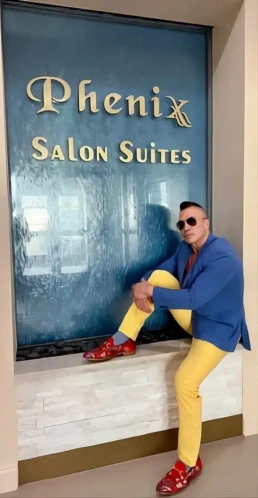 Randall Valentino Gonzales in a blue jacket, master hairstylist in Houston River Oaks.